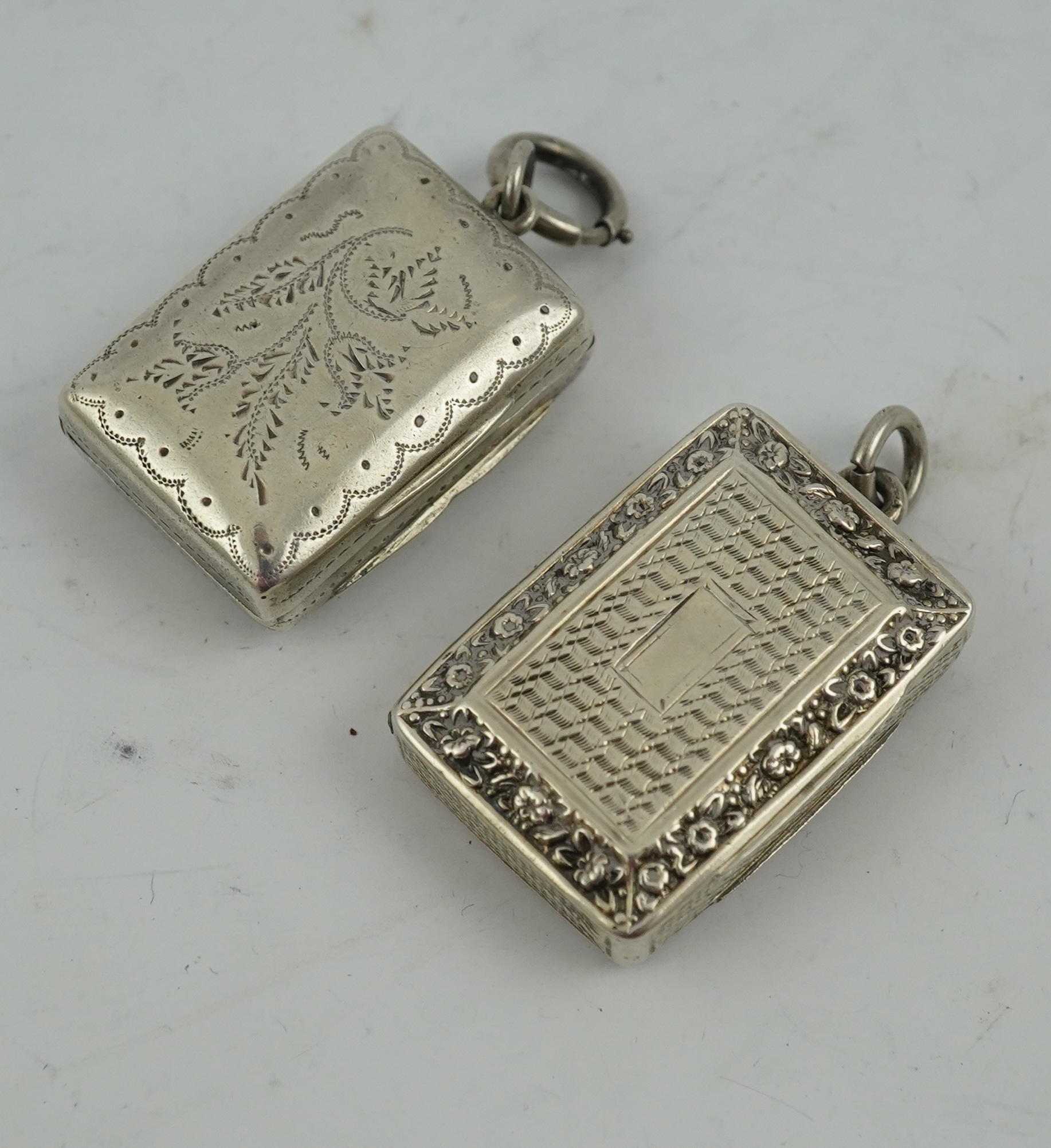 A George IV engraved and embossed silver rectangular vinaigrette by John Bettridge, Birmingham, circa. 1825, 32mm and a William IV vinaigrette by Thomas Simpson Jn. Birmingham, 1836.